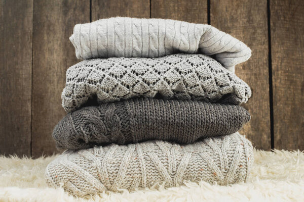 Stack of cozy knitted sweaters