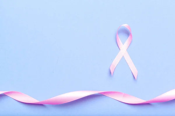 ribbon HIV, AIDS sign on blue background