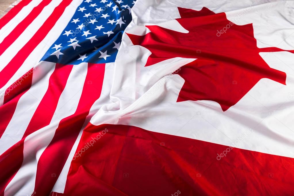 American and Canadian flags together