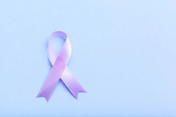 ribbon HIV, AIDS sign on blue background