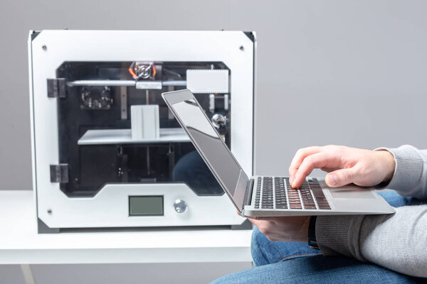 Designer Working With 3D Printer