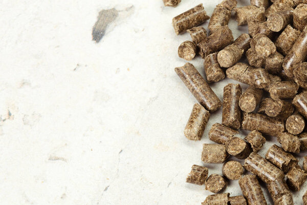 Energy. Pellets on the table on white background.