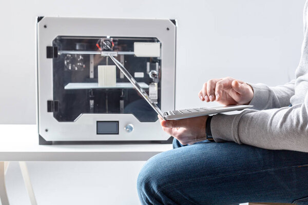 Designer Working With 3D Printer