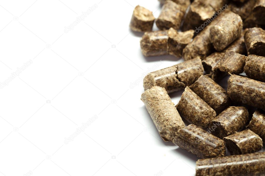 stack of wooden pellets for bio energy, white background, isolated.
