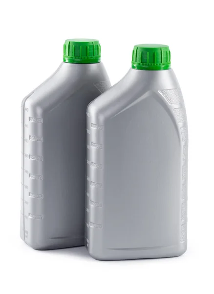 Frascos de plástico de aceites de automóvil aislados sobre un fondo blanco —  Fotos de Stock