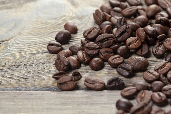 Coffee beans on wood background. Creative Photo