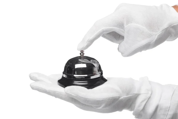 First-class service. Hand in white gloves holding hotel bell — Stock Photo, Image