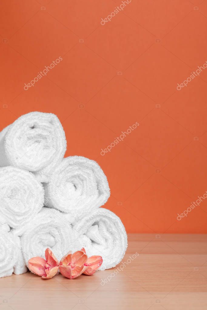 Clean soft towels on color background. creative photo.