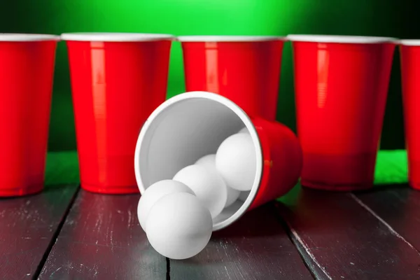 Cups for game Beer Pong on the table. creative photo.