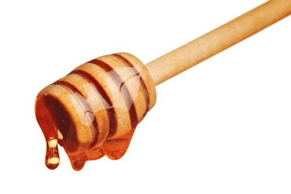 Honey and honey comb with wooden stick — Stock Photo, Image