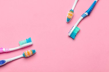 Toothbrushes on pink background. creative photo. top view