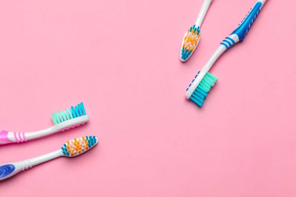 Toothbrushes on pink background. creative photo. top view — Stock Photo, Image