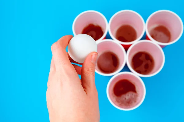 Cups for game Beer Pong on the table. Creative photo.