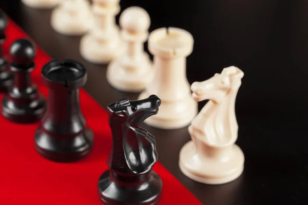 Chess business success, leadership concept. Red background.