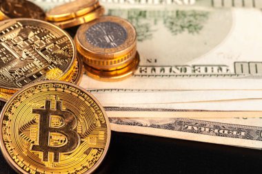 golden bitcoin coin and us dollars. creative photo.