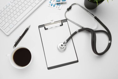 Stethoscope, clipboard and pills, closeup. Medical equipment. close up. creative photo.