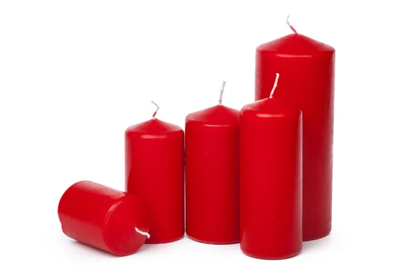 Výběr červených svíček na bílém pozadí — Stock fotografie