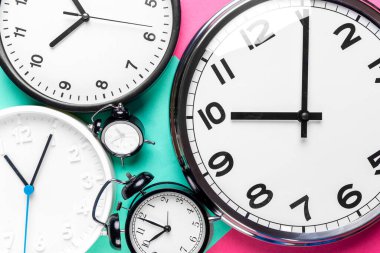 Many different clocks. close up. creative photo.