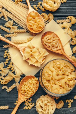 Various pasta on spoons. close up. creative photo.