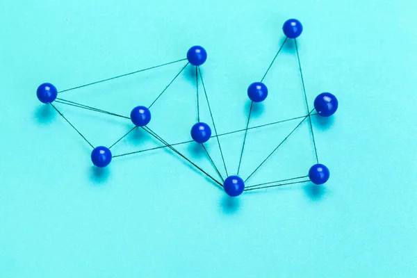 Pins connected creating a network. creative photo. — Stock Photo, Image