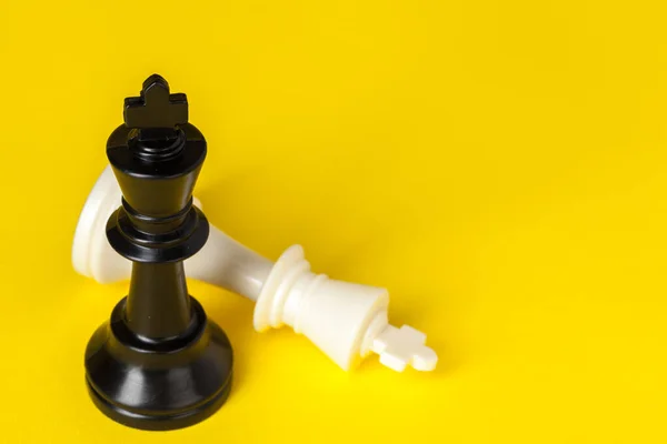 Chess figures on yellow background top view copy space — Stock Photo, Image