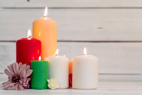 Home lighting candles on wooden table. creative photo. — Stock Photo, Image
