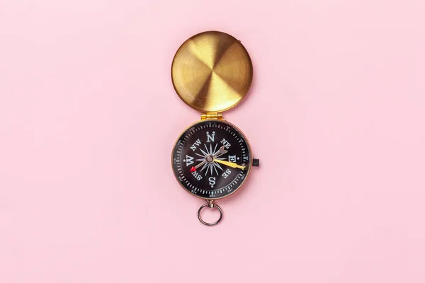 Compass on pink background, top view. creative photo. — Stock Photo, Image