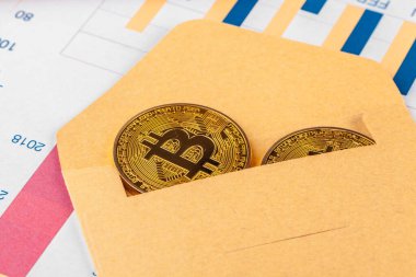 bitcoin and chart. close up. creative photo.