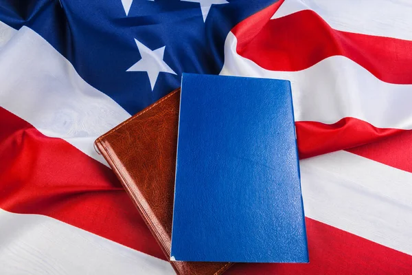 Bible laying on top of an american flag — Stock Photo, Image