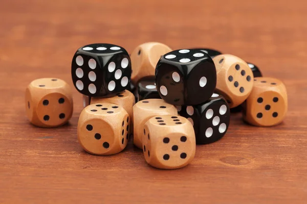 Dice on a wooden table. Concept for business risk.