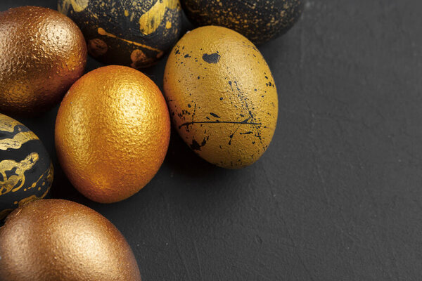 Background with golden decorated easter eggs creative photo.
