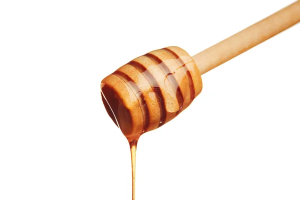 Med a medový hřeben s dřevěnou holí. Zavřít. — Stock fotografie
