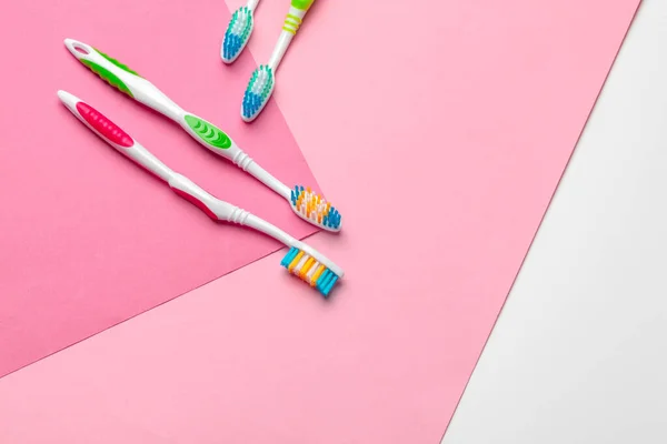 Toothbrushes on pink background. Macro photo. Close up. — Stock Photo, Image