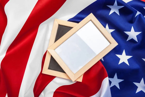 Blank frame on American flag background. Macro photo. Close up.