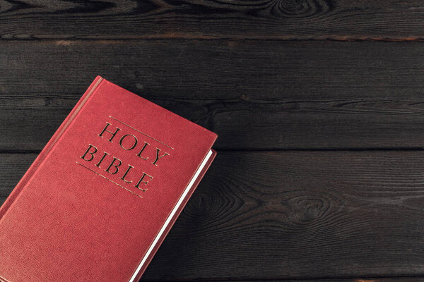 The Holy Bible on a wooden table. Close up.
