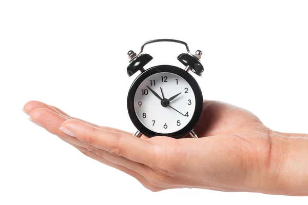 Reloj despertador de mano femenino sobre fondo blanco — Foto de Stock