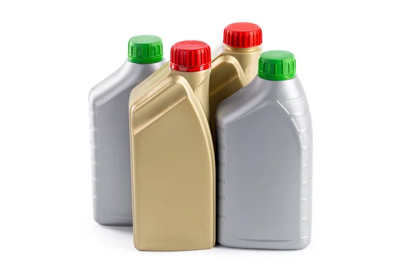 Plastflaskor från biloljor isolerade på en vit bakgrund — Stockfoto