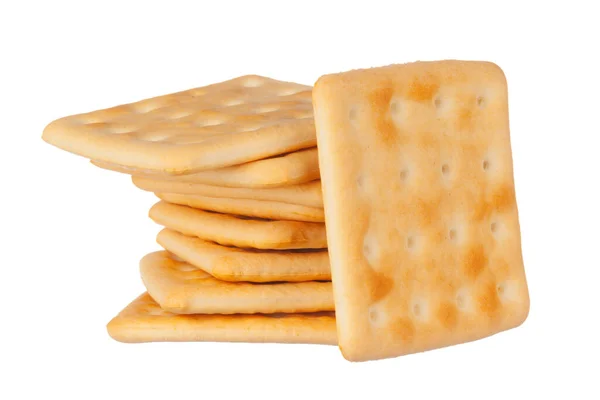 Cracker stapeln sich auf weißem Hintergrund. Nahaufnahme. — Stockfoto