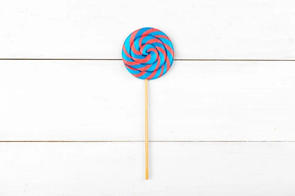 Sugar lollipop on the wooden table. Close up. — Stock Photo, Image