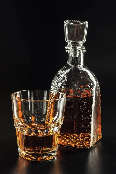 Glass of the whiskey and a square decanter — Stock Photo, Image