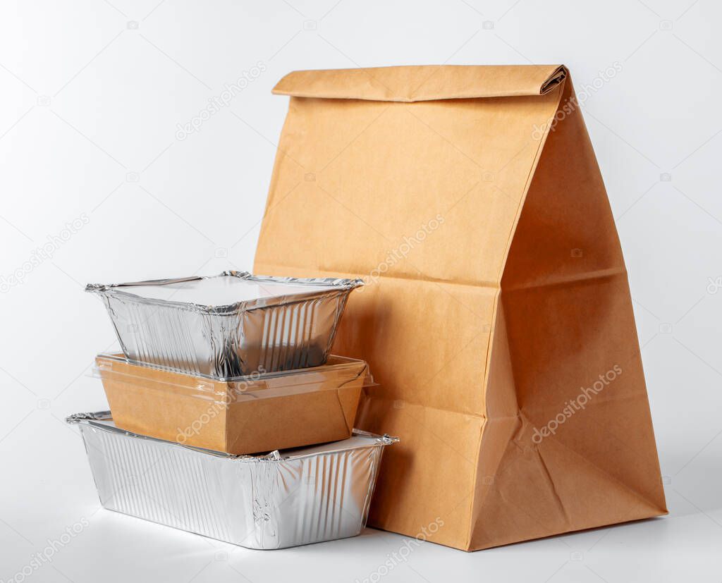 Set of recyclable food packaging on white background