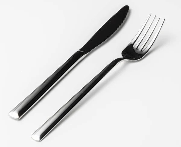 Forchetta e coltello isolati su fondo bianco — Foto Stock