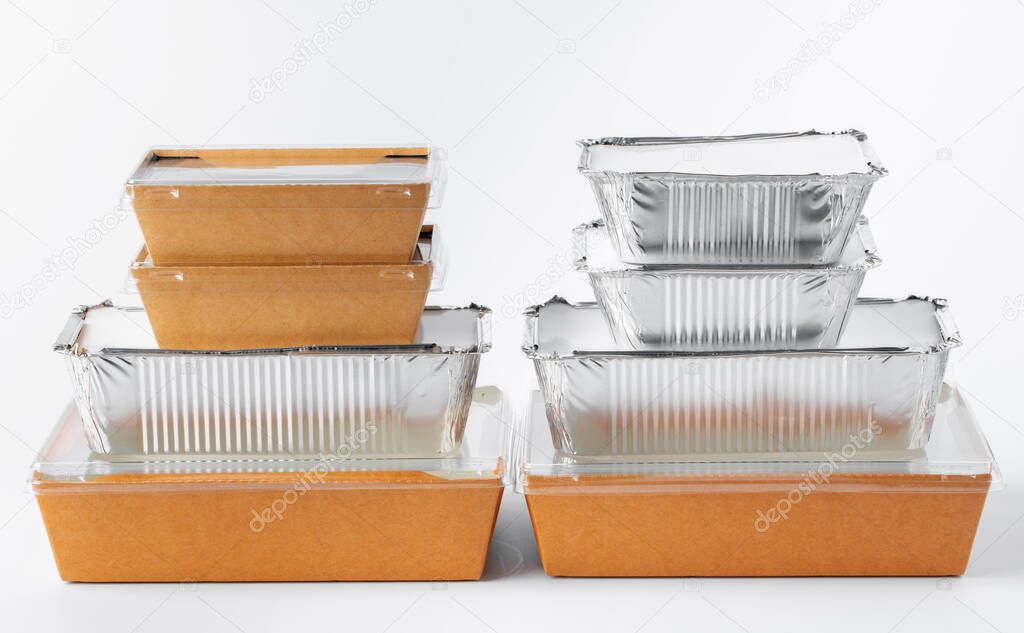 Assortment of food delivery containers on white background