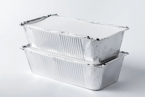 Foil food box with takeaway meal on white background — Stock Photo, Image