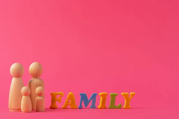 Wooden little figures of people. Family concept — Stock Photo, Image