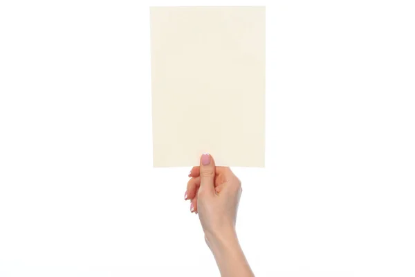 Kvinnlig hand som håller blankt vitt papper isolerat på vitt — Stockfoto