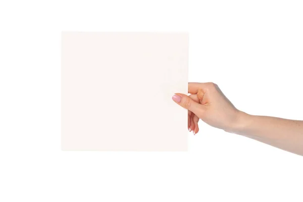 Womans hand showing white paper banner isolated on white — Stock Photo, Image