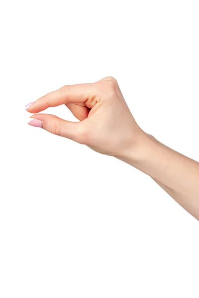 Mano femenina sosteniendo algo aislado sobre fondo blanco — Foto de Stock