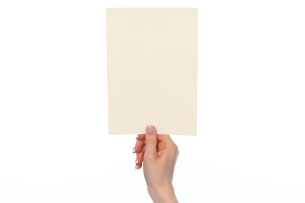 Female hand holding blank white sheet of paper isolated on white — Stock Photo, Image