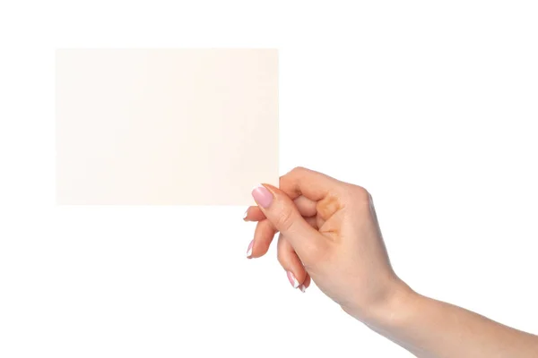 Frauenhand hält leeres weißes Blatt Papier isoliert auf weißem Papier — Stockfoto